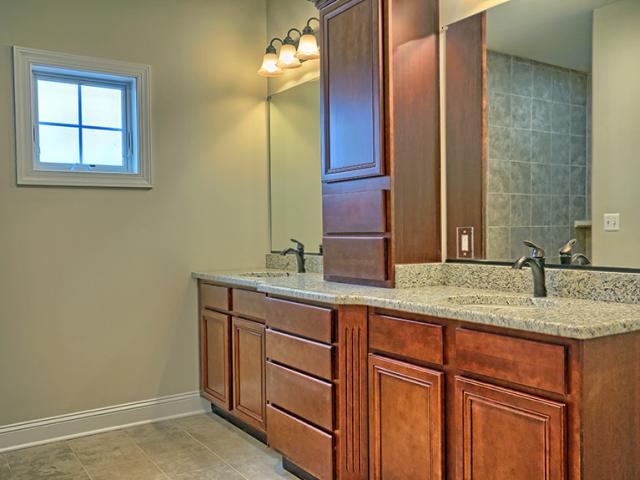 Hot water is heated by the geothermal system and a 93% efficient water heater. The hot water circulation system has motion sensors that allow it to anticipate when someone is likely to draw hot water.