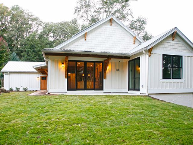 Large overhangs protect south-facing slider doors to minimize unwanted summer solar heat gain.