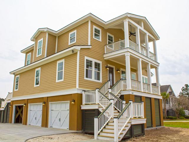 The house is built on piers to increase resistance to floods. Spray foam insulates and air-seals the underside of the floor above the garages and storage areas.