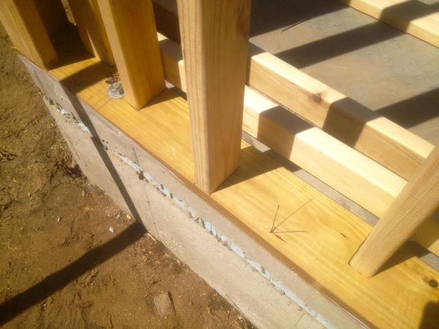 The 2-by-4 wall studs are offset from one another along the 2-by-6 horizontal sill plate creating space for insulation along the edges of the studs. When wall cavities are filled with insulation, this approach greatly reduces the transfer of heat through the wall.