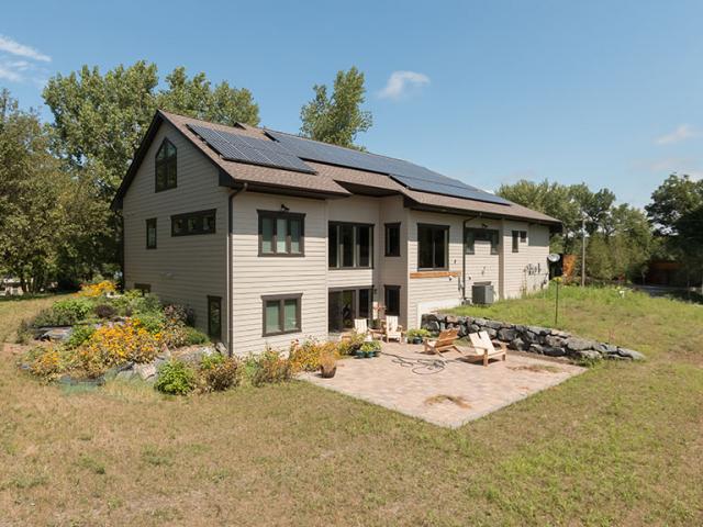 The builder took advantage of the rear-facing slope with a daylight basement design that provides more living space on a smaller footprint.