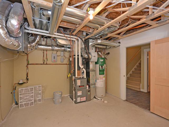 The high-efficiency comfort system includes a 98% efficient gas furnace and a high-efficiency air-source heat pump. A heat recovery ventilator provides fresh air to the home.