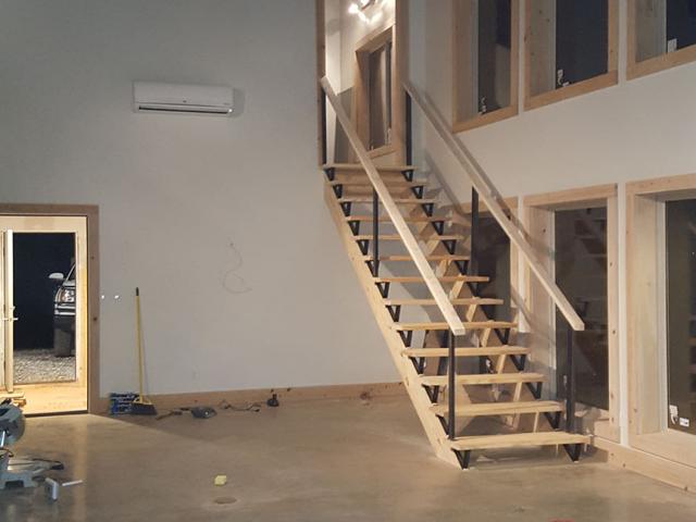 The home's heating and cooling needs are met by two wall-mounted mini-split heat pumps with seasonal energy efficiency ratios of 21.7. The highly efficient equipment also saves energy by eliminating ducts and the heat losses often associated with them.