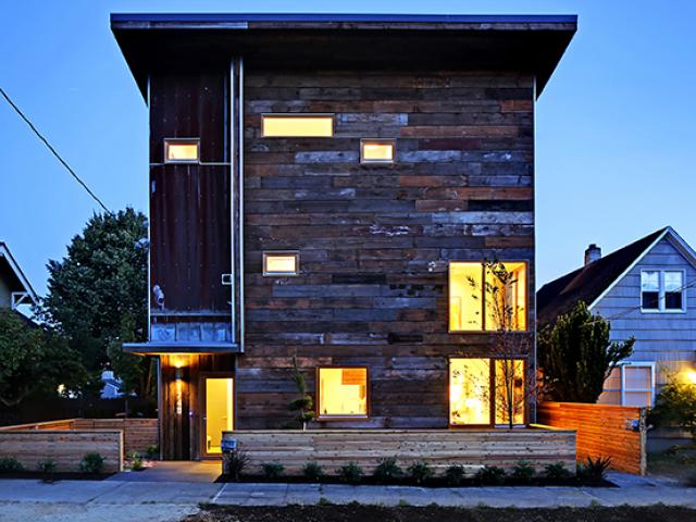 Reclaimed wood and metal roofing from old barns provides the unique exterior cladding of the home, which is located in Seattle’s historic Ballard neighborhood.
