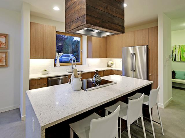 The home was equipped with a high-efficiency ENERGY STAR refrigerator, dishwasher, and clothes washer for energy and water savings. Other features include an induction range.