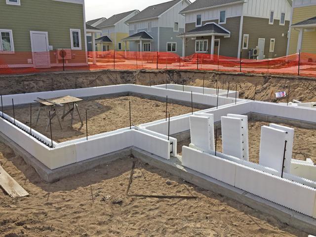 After pouring the footings, insulated concrete form (ICF) blocks were stacked 36 inches high and filled with concrete to form sturdy insulated foundation walls.