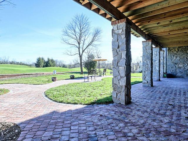 Site grading, pervious pavers, drywells, and the site's own natural topography are taken into account to minimize storm water runoff.