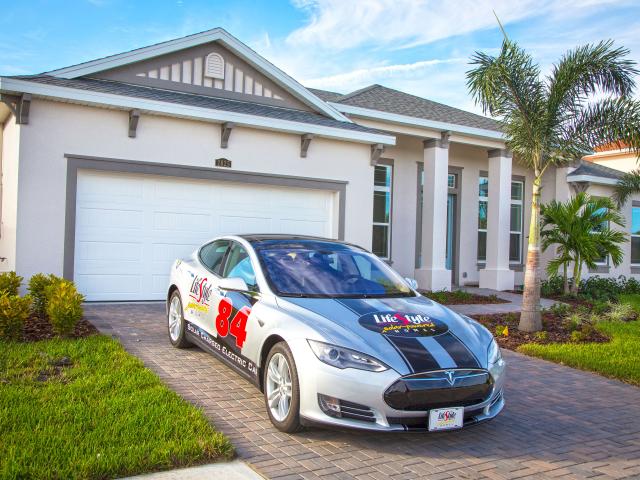 The solar-photovoltaic electric generation system helps to charge this electric car.