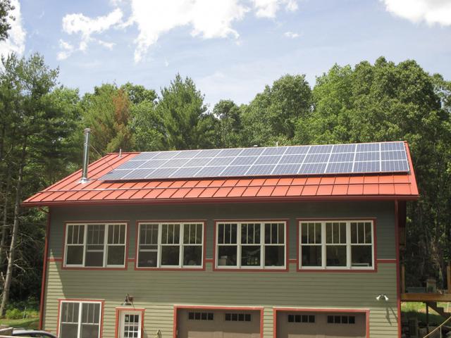 A 9.4-kW solar-photovoltaic electric generating system  and a high-performance thermal envelope consisting of double-stud walls filled with 12 inches (R-52) of dense-packed fiberglass insulation plus an unvented roof insulated along the underside with dense-packed R-60 to R-80 fiberglass helped provide combined energy cost savings of $5,470 compared to a similar-sized home built to the 2009 IECC.