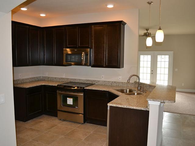 A heat-pump water heater supplies hot water to the kitchen and bathrooms.