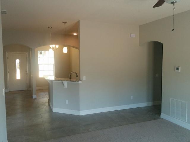 An air-source heat pump is centrally located within the home's conditioned space to efficiently heat and cool the home.