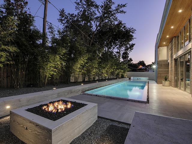 Board-form concrete walls are insulated along the inside with rigid foam providing an insulation value of R-19, while the unvented roof is insulated on the underside with R-21 of spray foam.