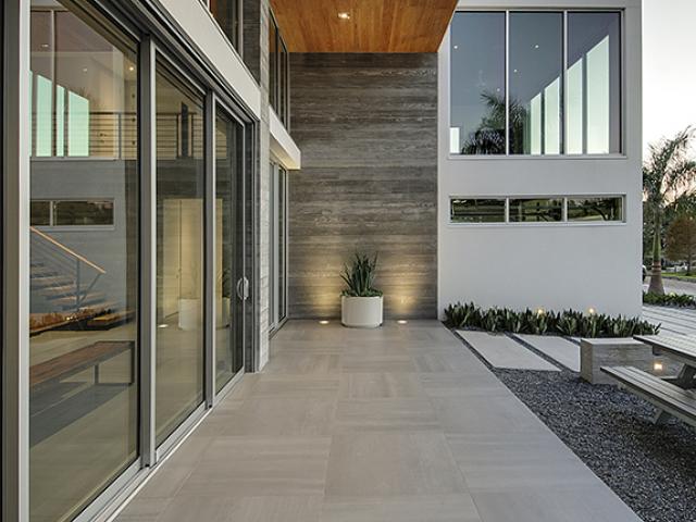 Deep overhangs protect most of the windows from direct overhead sun while low-emissivity coatings on the glass help block heat transmission into the interiors.