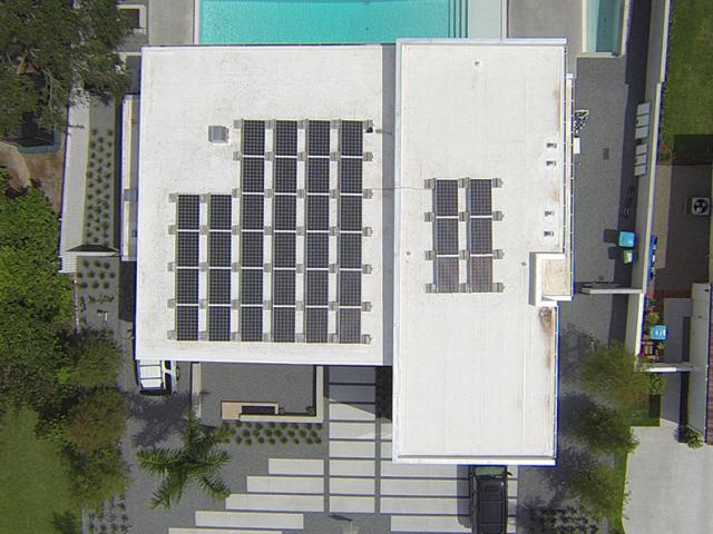 A 10-kW photovoltaic electric generating system installed on the roof helps save homeowners an estimated $2,850 in energy bills annually compared to a home built to code.