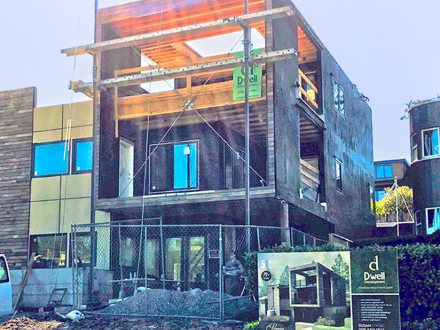 The double walls are sheathed with plywood then covered with a liquid-applied water-resistant barrier that provides a seamless air and water barrier for the walls.