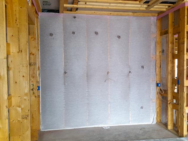 The home's 2-by-6 advanced-framed walls were filled with R-19 of blown cellulose. Sill sealing foam gaskets between the bottom plate and the slab provide protection against drafts, bugs, and moisture intrusion.