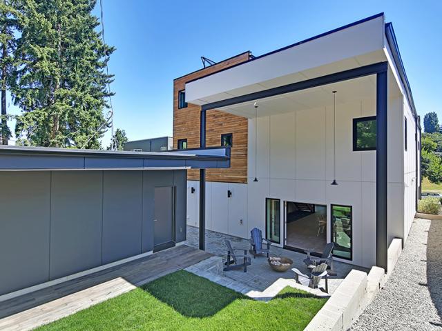 Fiber cement and white oak siding provide a durable cladding for the home.