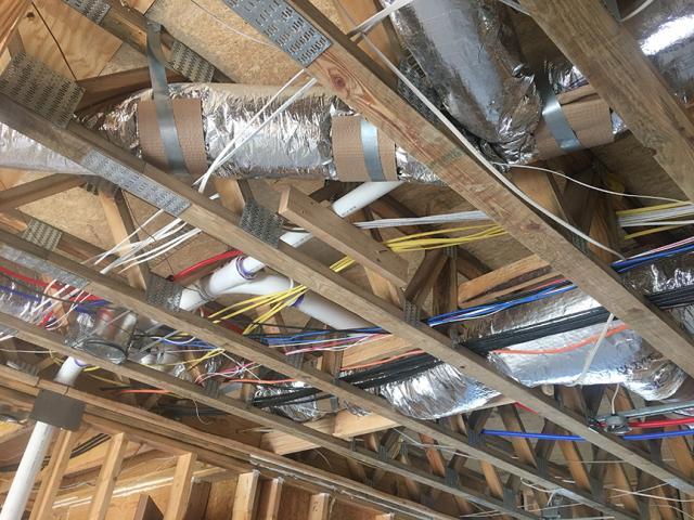 The home is equipped with a highly efficient central air source heat pump and all of the ducts are located within the conditioned space of the home in the open-web joists between the floors.