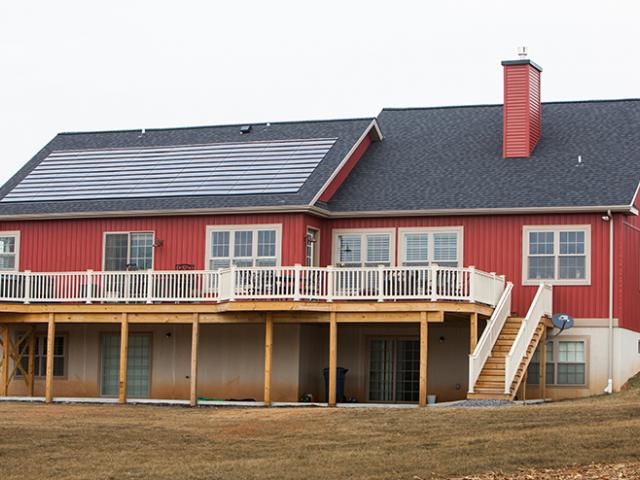 The rear exterior utilizes a French drain system directing water to a 12-by-6 drywell. The Rose Acres Project also features a 5.94-kW system of solar shingles.