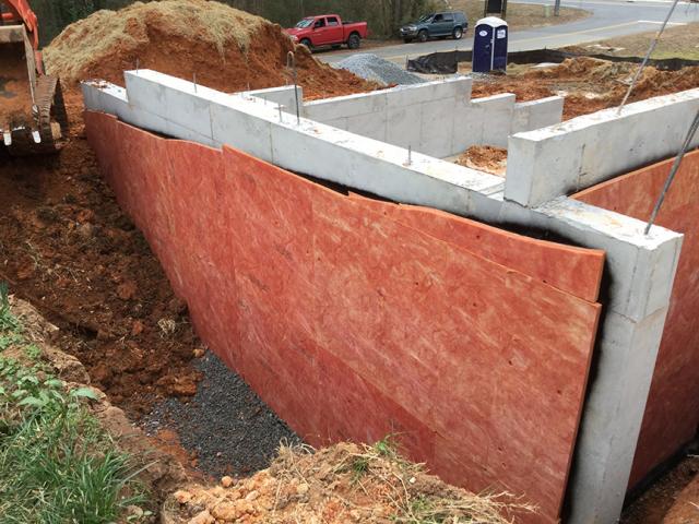 Below-grade walls were insulated along the exterior with R-5 of bug-resistant, high-density, rigid fiberglass insulation and along the inside with R-7 of closed-cell foam to R-7.