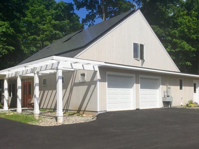 The 12-kW PV panel array will help this home achieve net zero energy usage and is expected to save the homeowners more than $5,000 per year in utility costs.