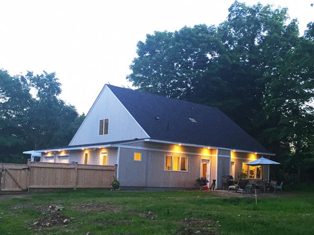The simple gable roof was insulated below the roof deck with 2.5 inches of closed-cell polyicynene and 3.5 inches of mineral wool insulation.