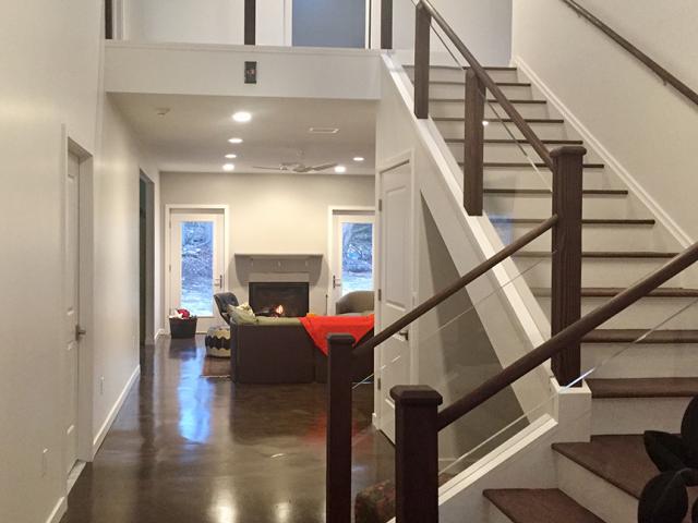 The stained concrete floors provide a water-resistant durable surface and can serve as thermal mass for beneficial wintertime passive solar heat gain.