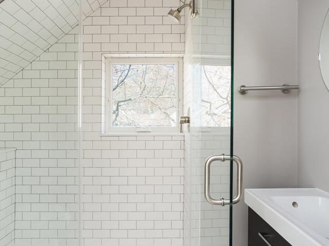 Hot water is supplied by a 96% efficient tankless gas water heater that is centrally located in a second-floor utility closet to reduce wait times for hot water. EPA WaterSense-labeled fixtures further reduce water usage.