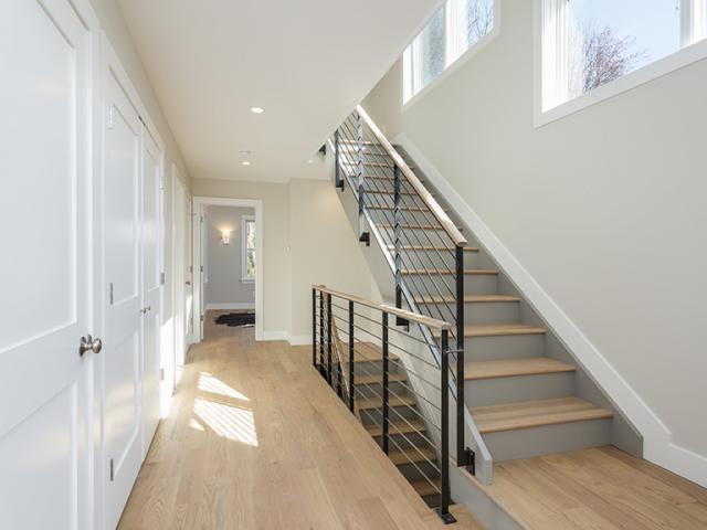 Two 96% efficient gas-fired furnaces and a 16 SEER air conditioner condition the three-floor home. All of the ductwork is in conditioned space.