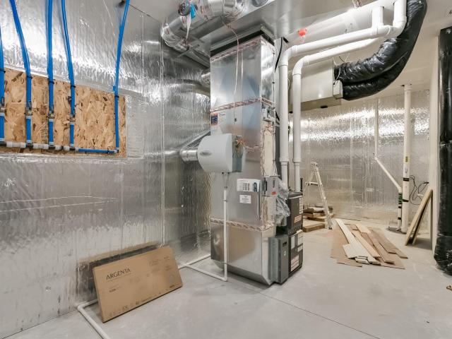 In this cold Minnesota climate, the home's primary heating source is a 96 AFUE gas furnace, while a 9.2 HSPF, 19.2 SEER heat pump provides high-efficiency cooling and could also be used as a back-up heating source. An energy recovery ventilator adds fresh air to the system.