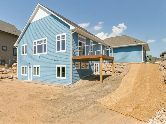 Two inches of rigid foam provides a continuous blanket of insulation beneath the engineered wood lap siding.