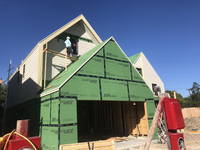 Coated OSB sheathing wraps the 2-by-6, 16-inch on-center walls, which are filled with 4 inches of open-cell spray foam.