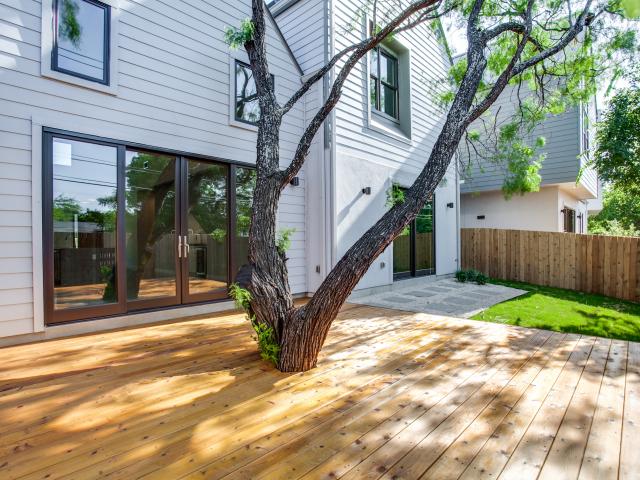 Stucco, stone, and fiber cement lap siding, and metal roofing provide a durable finish over the coated OSB sheathing for these Texas homes.