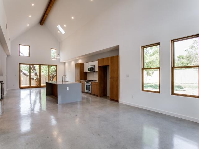 LED lights supplement the natural light that floods interiors from ENERGY STAR windows and skylights. The stained concrete floors provide durable surfaces with minimal maintenance.