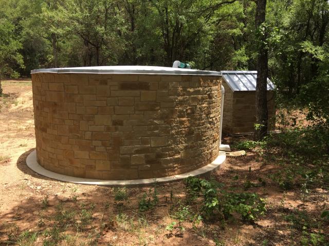 This 10,000-gallon rainwater tank is the home’s only source of water and supplies both potable and irrigation water.