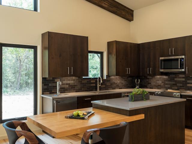 LED surface-mounted disc lights mimic the look of recessed lighting without compromising the SIPs performance.