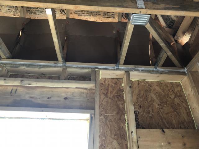 Before installing drywall, the walls are thoroughly air-sealed by caulking the framing to the sheathing and caulking wood-to-wood seams.