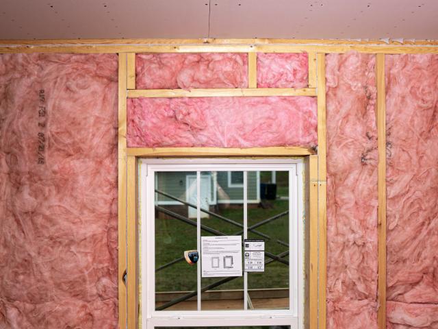 Unfaced batt insulation was carefully installed to completely fill the wall cavities between the 2-by-6, 24-inch on-center studs.