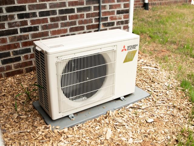 A single very high-efficiency (12.5 HSPF, 26.1 SEER) ductless mini-split heat pump provides all of the heating and cooling the compact home needs. The ducted ERV helps distribute the conditioned air throughout the home.