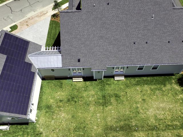 The detached garage had the best orientation for installing the 6.5 kW of solar shingles.