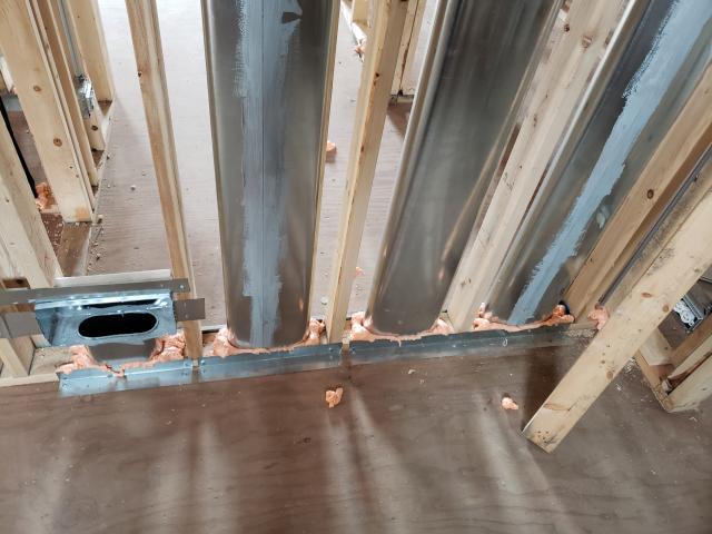 Fire-rated caulk air-seals around the ducts.
