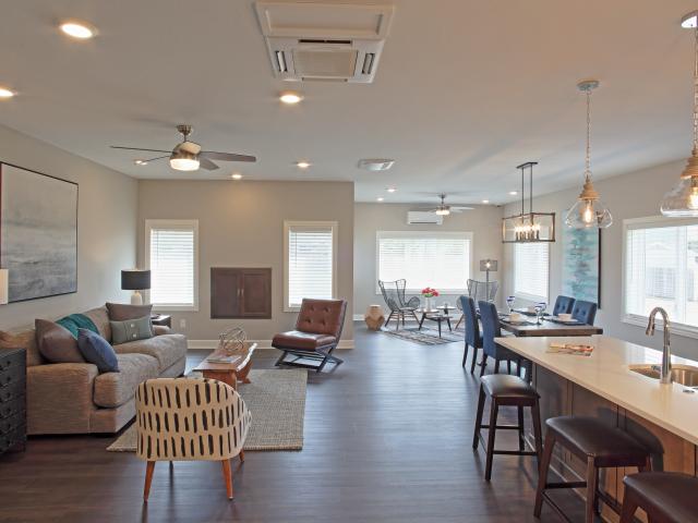 High-efficiency mini-split heat pumps heat and cool the home. An energy recovery ventilator (ERV) installed in the largest open area of the home ensures controlled conditioned constant fresh air, while a whole-house wall-mounted dehumidifier helps keep the indoor air comfortably dry .