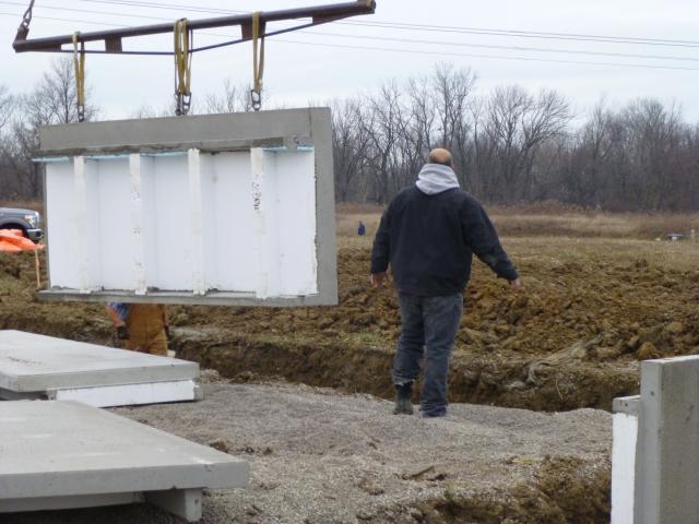 For the foundation, Sareth used pre-fabricated concrete wall panels that come with an R-20 layer of EPS foam insulation factory attached to the interior side of the panels. The builder added R-20 XPS + polyiso rigid foam on the surface and face of the slab shelf to stop thermal bridging at the perimeter of the slab.