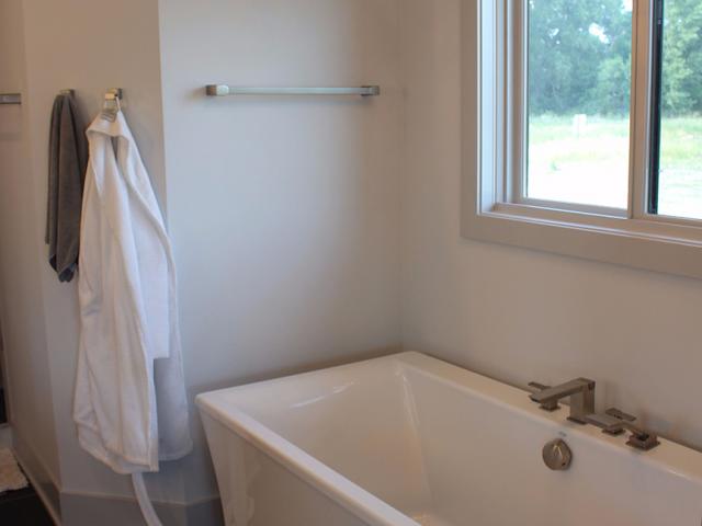 Two highly efficient tankless gas boilers provide endless hot water to the tubs, showers, and faucets, as well as to the fan coil system that heats the home.