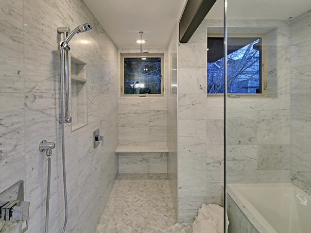 A heat pump hot water heater provides plenty of hot water, but water waste is minimized with EPA WaterSense rated low-flow fixtures and a timer-operated recirculation pump on the furthest hot water runs.