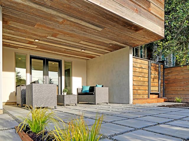 Pervious pavers allow rainwater to percolate into the soil on site rather than flowing into the street.