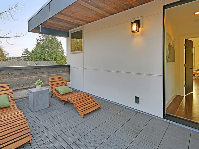 A variety of balconies and patios encourage the natural ventilation of open doors despite the tight urban lot lines.