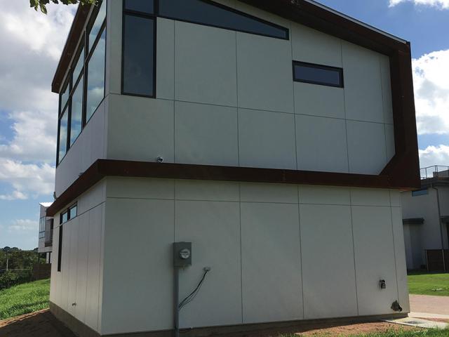 A highly efficient air-source mini-split heat pump with a 20 SEER cooling efficiency and a 9.6 HSPF heating efficiency provides cooling and heating for the small home.