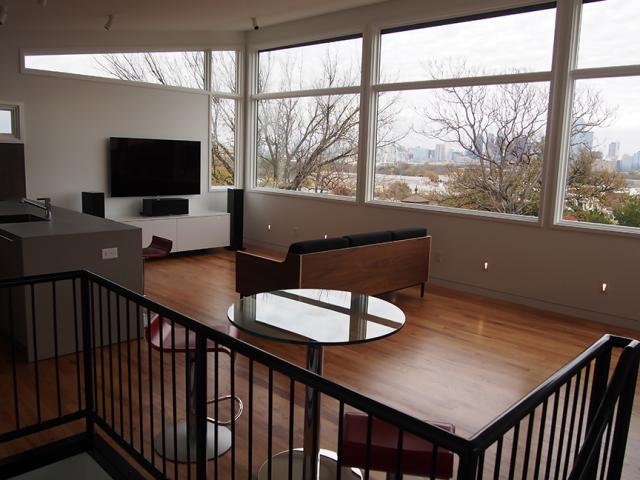 Exterior rolling shutters on the east-facing windows allow homeowners to easily control sun exposure.