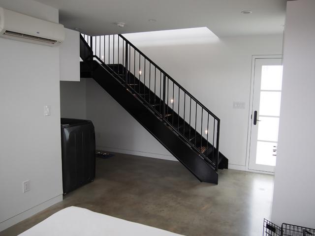 Stained concrete floors are low-maintenance, do not feed mold, and provide some passive solar benefit.